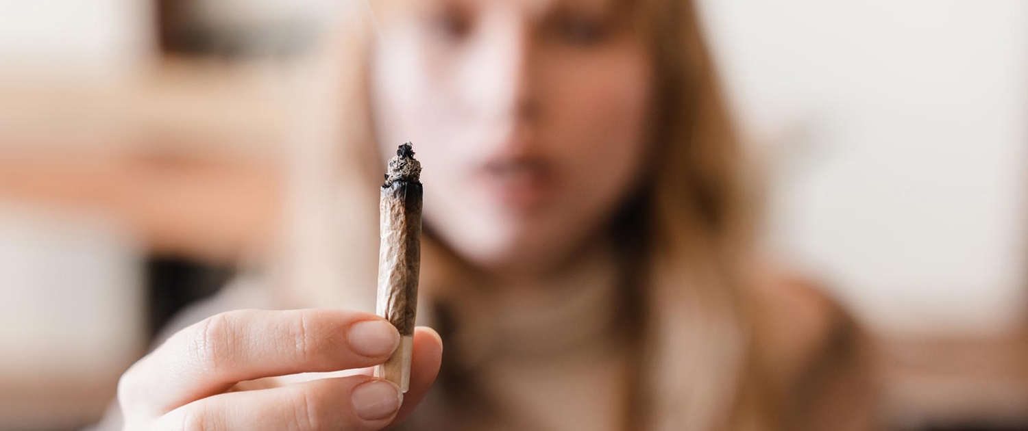 Close up image of weed joint with smoke